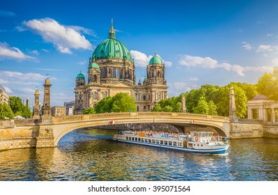 Beautiful view of historic Berlin Cathedral (Berliner Dom) at famous Museumsinsel (Museum Island) with excursion boat on Spree river in beautiful evening light at sunset in summer, Berlin, Germany - Shutterstock ID 395071564