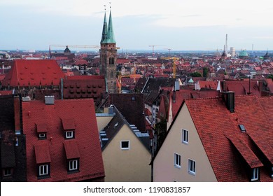Beautiful View Of Historical Nuremberg City At Sunset. Historic Highlights of Germany. Nuremberg is the birthplace of Albrecht Duerer and Johann Pachelbel. Red-Brown Evening Background. 