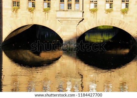 Beautiful View Of Historical Nuremberg City And Pegnitz River At Sunny Day. Historic Highlights of Germany. Nuremberg is the birthplace of Albrecht Duerer and Johann Pachelbel. Yellow-Brown Background