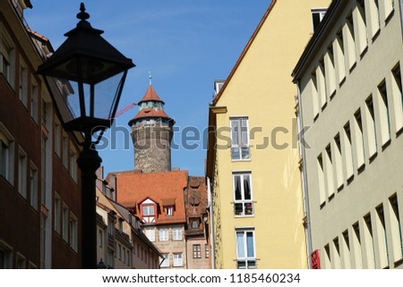 Beautiful View Of Historical Nuremberg City At Sunny Day. Historic Highlights of Germany. Nuremberg is the birthplace of Albrecht Duerer and Johann Pachelbel. Red-Brown And Yellow Autumn Background. 