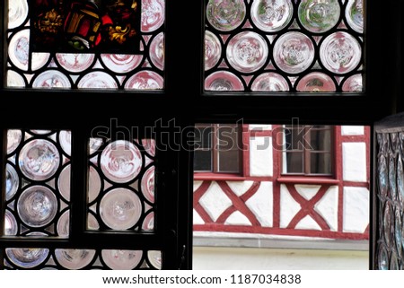 Beautiful View Of Historical Nuremberg City Out Of The Window. Historic Highlights of Germany. Nuremberg is the birthplace of Albrecht Duerer and Johann Pachelbel. Red-Brown And White Background. 