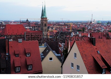 Beautiful View Of Historical Nuremberg City At Sunset. Historic Highlights of Germany. Nuremberg is the birthplace of Albrecht Duerer and Johann Pachelbel. Red-Brown Evening Background. 