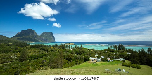 Beautiful view of houses between the trees and Mount Lidgbird and Mount Gower, taken from Malabar Cliffs Lord Howe Island, New South Wales, Australia