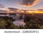 Beautiful view to Iguazu Falls waterfalls with green rainforest