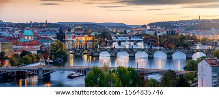Beautiful view to the illuminated cityscape and bridges of Prague, Czech Republic, including the famous Charles Bridge and old town just after sunset time Foto stock © 
