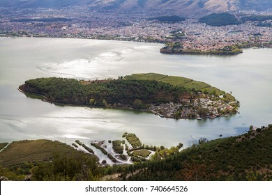 Beautiful view of Ioannina lake from Ligkiades mountain village with the lake island in the foreround and Ioannina city in the background - Shutterstock ID 740664526