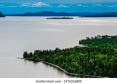 Beautiful View Of Kama Bay In Nipigon Ontario Canada Showing Lake Superior And Coastal Shore, High Contrast Blue Sky And Sparkling Water In Summer