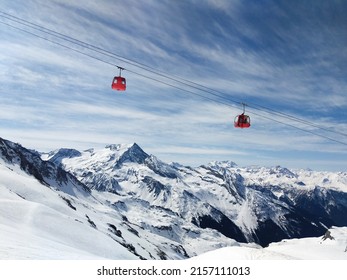 A beautiful view of the La Plagne glacier cable car on a sunny day in Alpes, France