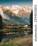 Beautiful view of Lac des Gaillands with Mont Blanc massif and train at station in the sunset at Chamonix, Savoie, France