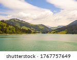 A beautiful view of a lake surrounded by mountains in Lac de l