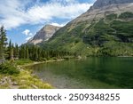 A beautiful view of lakes and mountains from the shore of Bullhead Lake, Many Glacier, Glacier National Park, Montana