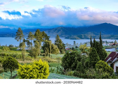 beautiful view from the lakeside with mountains in the background in the morning with blue water