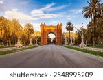 Beautiful view of the landmark Arc de Triomf in Barcelona, Spain, during golden sunrise without people