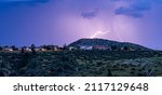 A beautiful view of lightning striking above houses in Prescott Valley, Arizona