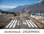 Beautiful view of Lukla airport one of the most dangerous airport in the world in Nepal. The runway rests on a hillside in the town of Lukla, Nepal.