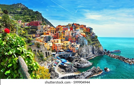 Beautiful view of Manarola town. Is one of five famous colorful villages of Cinque Terre National Park in Italy, suspended between sea and land on sheer cliffs. Liguria region of Italy. 