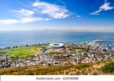 Beautiful View Of Mouille Point, Green Point With A Football Stadium And The V And A (Victoria And Alfred) Waterfront In Cape Town Seen From Signal Hill. Sunny Day With A Few Clouds. South Africa. 