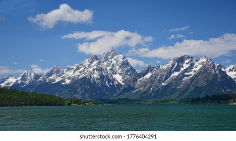 beautiful view of mount moran and the teton range on a sunny summer day  from jackson lake dam in  grand teton national park in wyoming