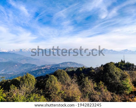 A beautiful view of mountain range under a cloudy sky in Nagarkot, Nepal