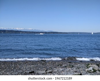 Beautiful view of the Olympic mountains across the Pacific Ocean on a sunny, cloudless day
