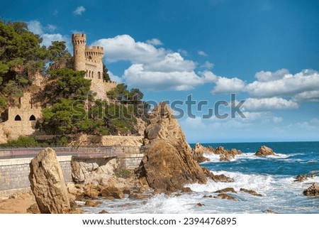 Beautiful view on Castell d'en Plaja from seaside in Lloret de Mar, Costa Brava, Spain. Sunny summer day in Lloret de Mar. Rocky coastline in spanish beach Imagine de stoc © 