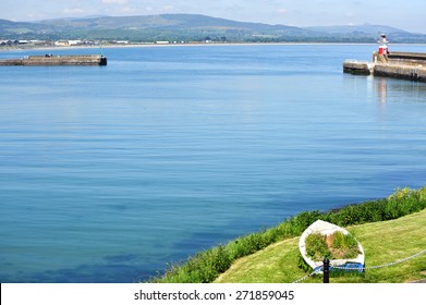  Beautiful view on summer harbour and lighthouse in Wicklow town, Ireland