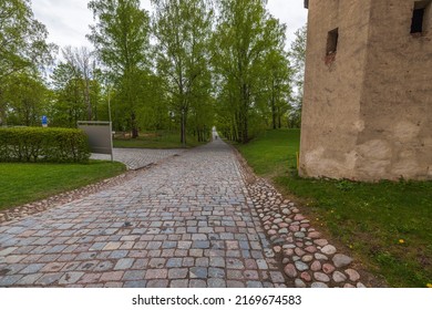 Beautiful view of pavement in park lined with old cobblestones in historic center. Sweden.