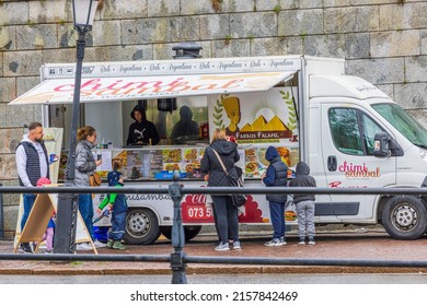 Beautiful view of people near mobile outdoor snack bar vehicle. Sweden. Uppsala. 05.14.2022.