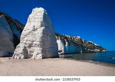 A Beautiful View Of The Pizzomunno, A Large White Rock Monolith In Spiaggia Di Castello Beach In Italy