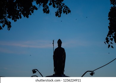 Beautiful View Of The Pope Statue Silhouette Infornt Of The Blue Sky