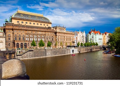 beautiful view of the Prague National Theater on a bright sunny day along the Vltava River