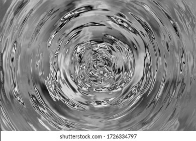 A beautiful view of radial water ripples when something touches its surface or vibration occurs