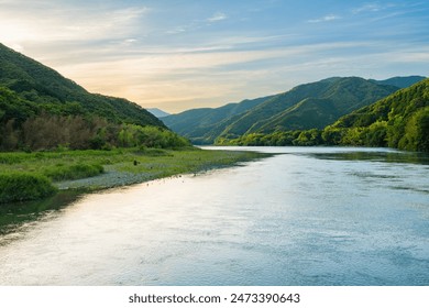 Beautiful view of a river surrounded by trees in the forest, Shimanto River in Kochi Prefecture in Japan, Travel or outdoor, Nobody - Powered by Shutterstock