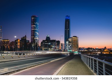Beautiful view to road and illuminated skyscrapers in Santiago, Chile. Horizontal outdoors shot