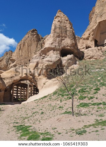 Beautiful view of rock-cut monastery in Selime, Cappadocia, Turkey with blue sky background.