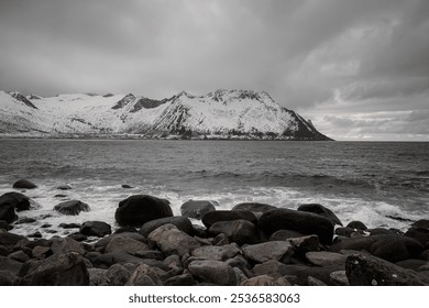 Beautiful view of the rocky shore of the ocean, the waves of which crash against the rocks - Powered by Shutterstock