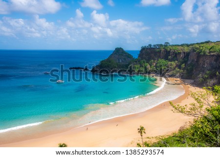 Beautiful view of sancho beach in fernando de noronha elected the most beautiful beach in the world for 3 times with a beautiful day, sky and blue sea, lots of sun, nature and few people