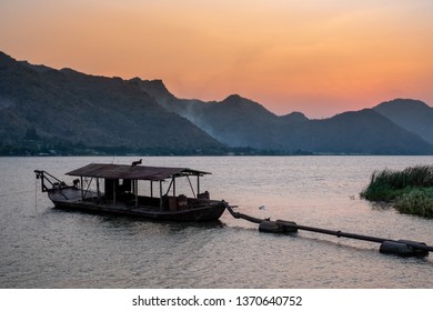 Beautiful View With Sand Suction Boat And Mountain On Sunset.