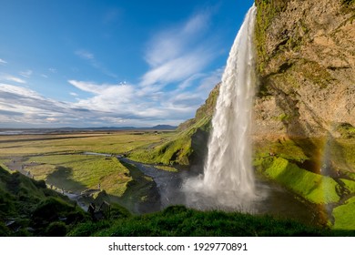 A beautiful view of the Seljalandsfoss waterfall in Iceland under a cloudy sky