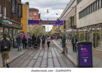 Beautiful view of shopping street with shops and people in downtown of Uppsala. Sweden. Uppsala. 05.14.2022.