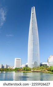Beautiful view of skyscraper by lake at downtown of Seoul, South Korea. Amazing modern tower on blue sky background. Wonderful sunny cityscape. Seoul is a popular tourist destination of Asia. - Shutterstock ID 2255926627