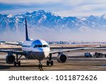 Beautiful view of the snow covered mountains from Salt Lake City whilst in the airport lounge getting ready for departure during winter.  