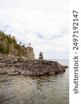 A beautiful view of Split Rock Lighthouse on the rocky coast of Lake Superior.