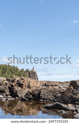 A beautiful view of Split Rock Lighthouse on the rocky coast of Lake Superior.