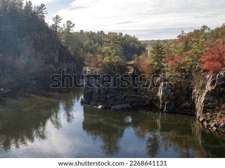 Beautiful view of the St. Croix River and Angle Rock at Interstate State Park on an autumn day in Taylors Falls, Minnesota USA.