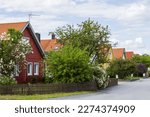 Beautiful view of suburban village with lilac blooming garden trees. Uppsala. Sweden. Europe. 