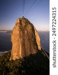 Beautiful view from Sugar Loaf Mountain cable car to green rainforest, ocean and city, Rio de Janeiro, Brazil