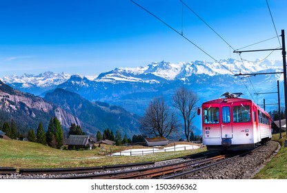 Beautiful View Of The Swiss Landscape With A Train.