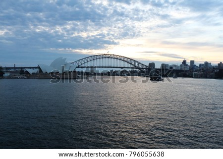 Beautiful view of the Sydney opera house and the harbour bridge at sunset