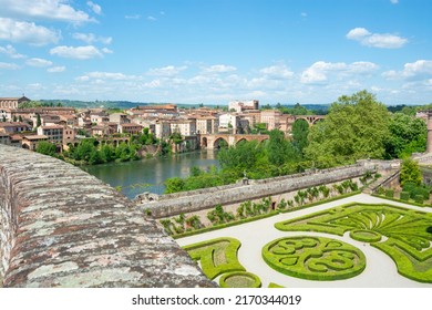 Beautiful View Of The Tarn River And A Garden With Flowers In The Toulouse-Lautrec Museum In Albi In France.